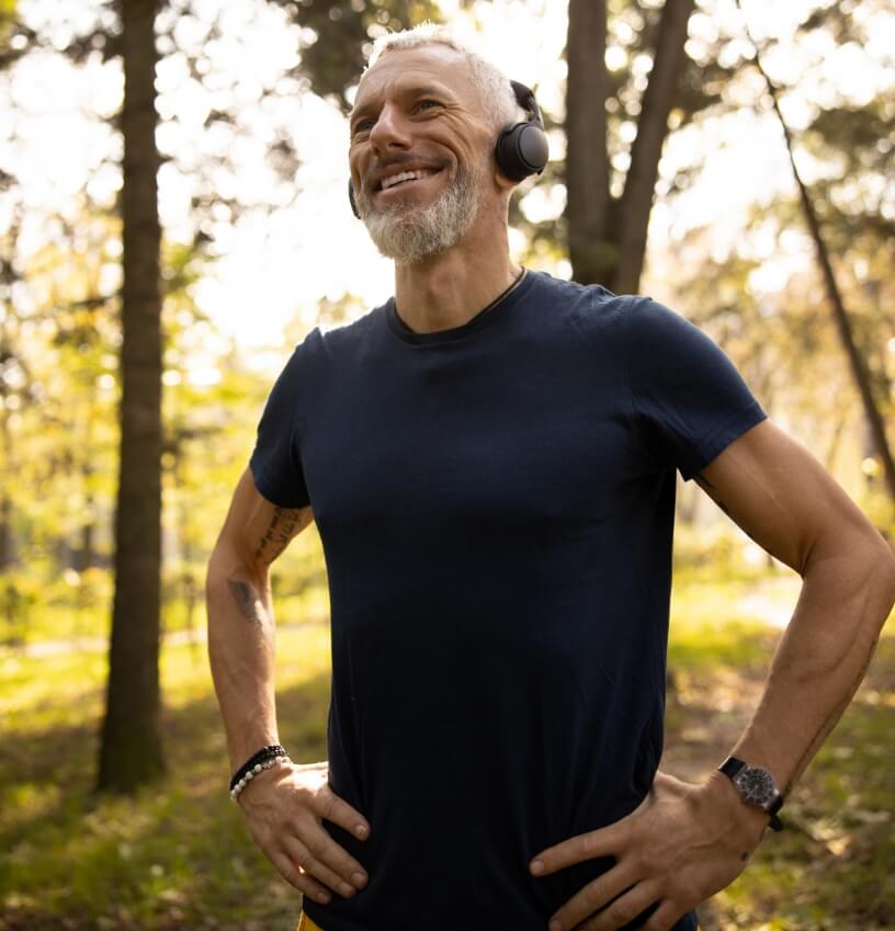 happy-fit-man-listening-to-music-in-wood-2023-11-27-05-18-23-utc (1)