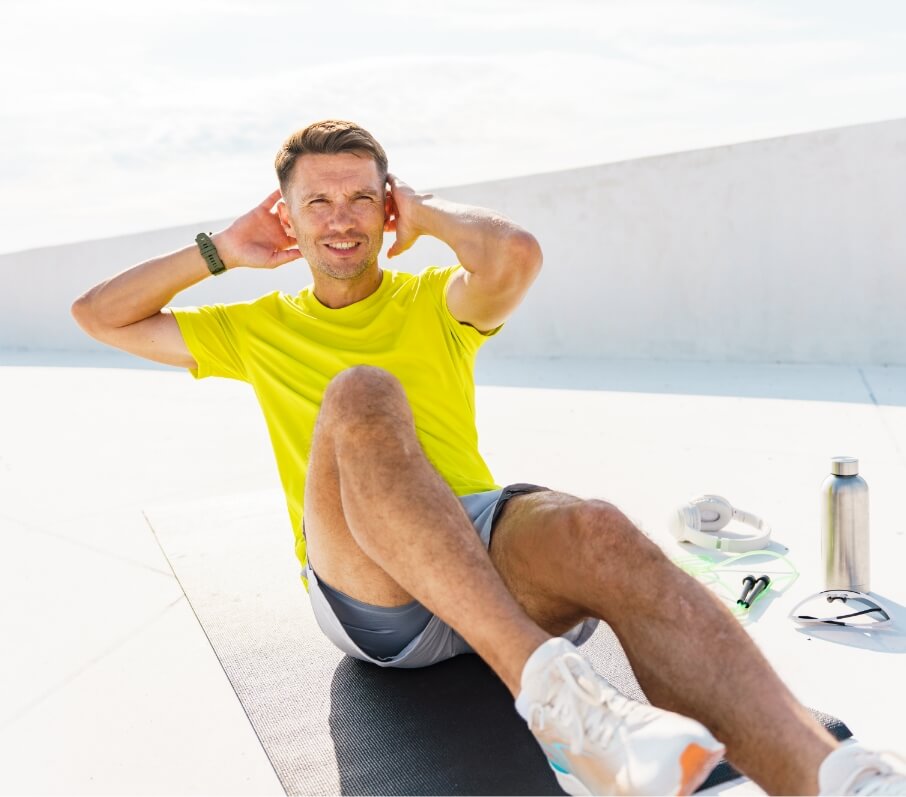 man-in-a-yellow-shirt-doing-sit-ups-on-a-workout-m-2024-09-13-19-58-48-utc (1)