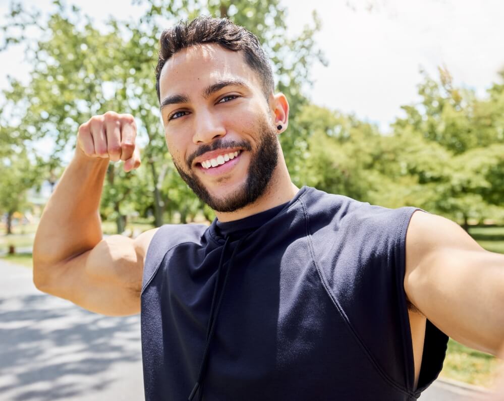 portrait-of-a-sporty-young-man-flexing-his-bicep-a-2025-04-06-07-52-59-utc (1)